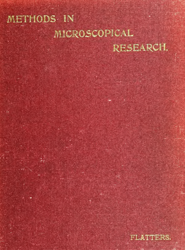 A red book with gold text
Description automatically generated