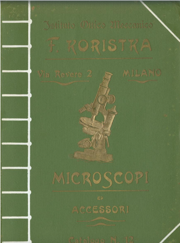 A green book with a picture of a microscope
Description automatically generated