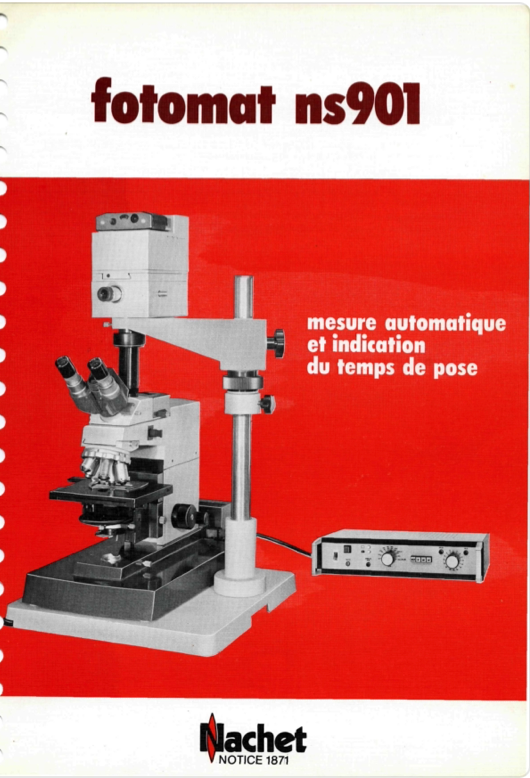A white and black microscope
Description automatically generated