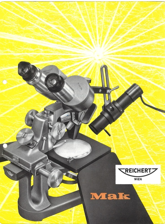 A microscope on a yellow background
Description automatically generated