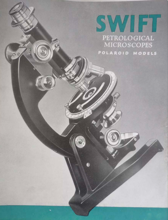 A black and silver microscope
Description automatically generated