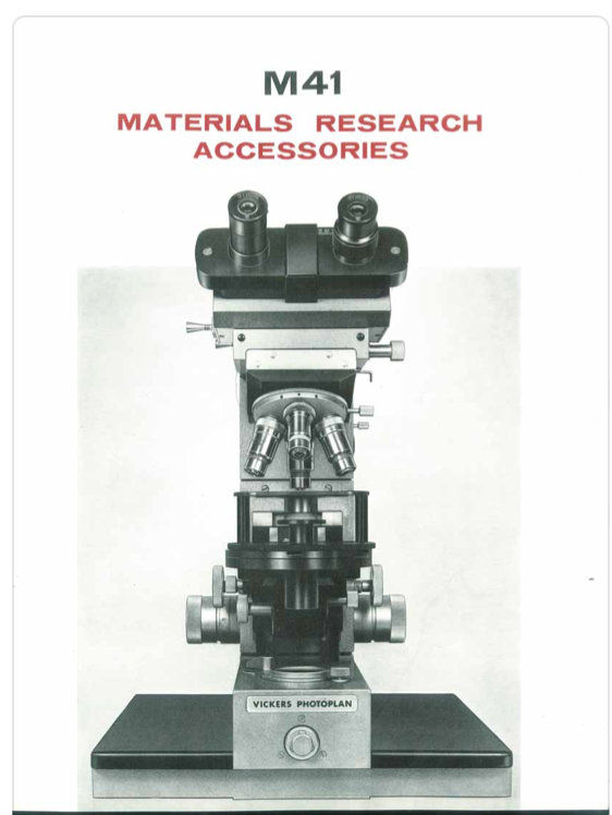 A close-up of a microscope
Description automatically generated