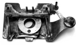 A metal object with a hole in the middle
Description automatically generated with low confidence