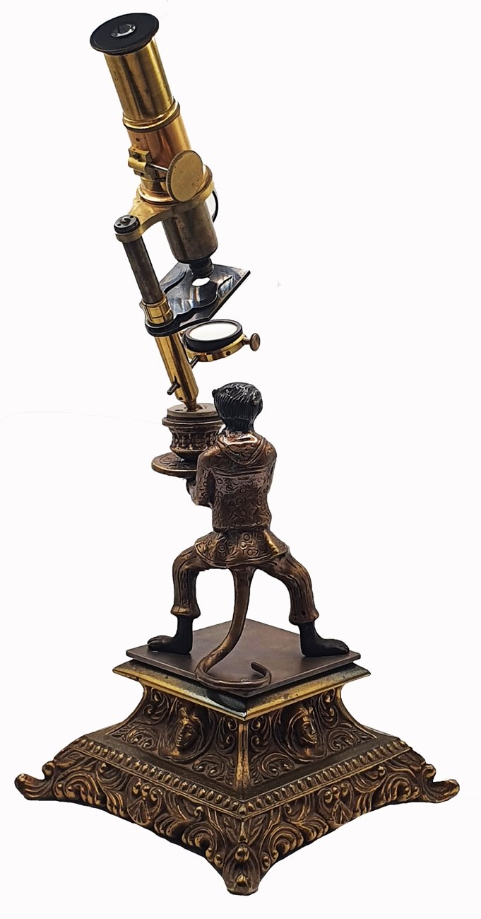 Microscope Statue A statue of a person holding a microscopeDescription automatically ...