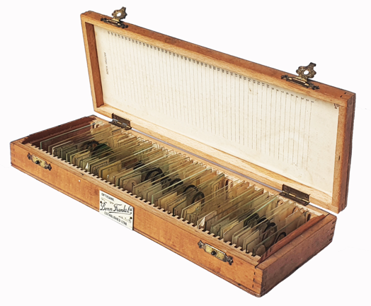 A wooden box with slides inside
Description automatically generated