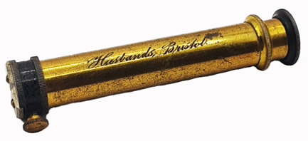 A close-up of a gold tube
Description automatically generated